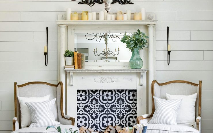 A classic white mantelpiece. Instead of a fire, the mantel sports a blue and white tiling with a unique pattern