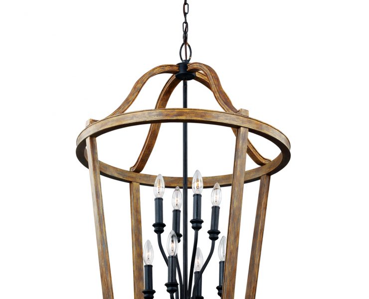 A large chandelier with a wood dome surrounding several light bulbs connected in black metal