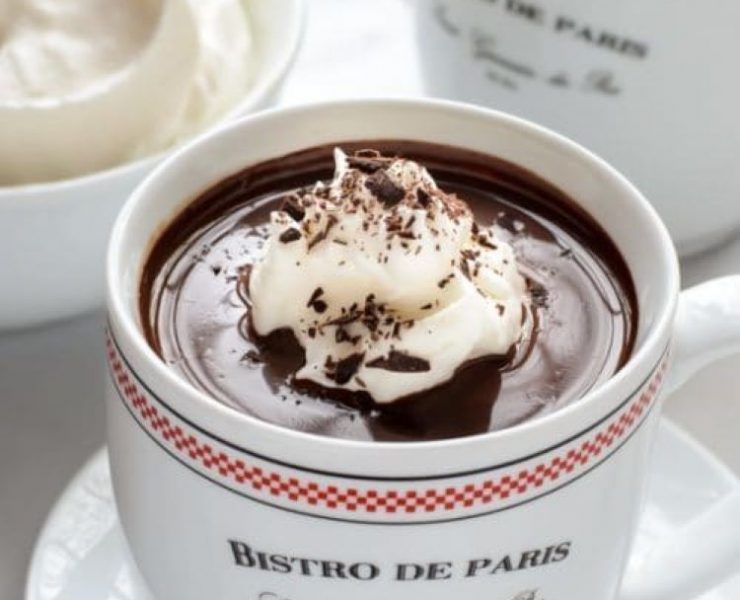 A bistro de Paris cup full of rich hot chocolate with rich dark flavors and whipped cream
