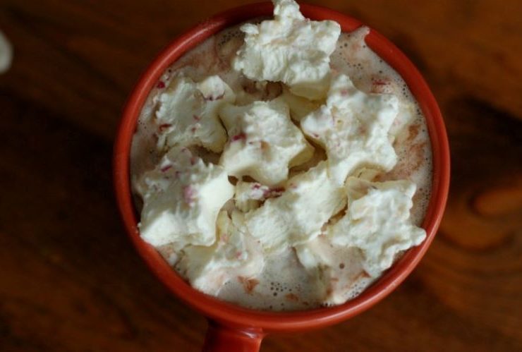 Marshmallow star cutouts float in a hot chocolate mix
