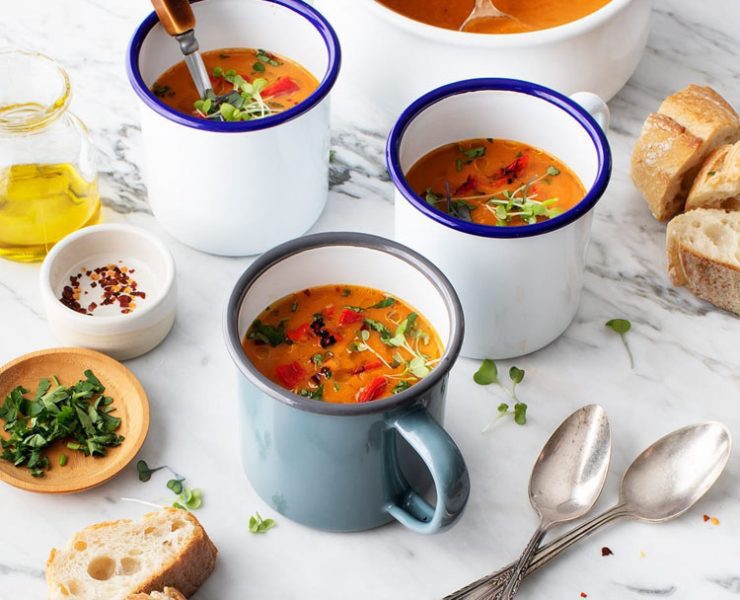 Three mugs full of roasted red pepper soup, one of our favorite farmhouse soup recipes.