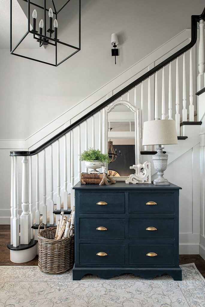 Stairway with navy blue dresser