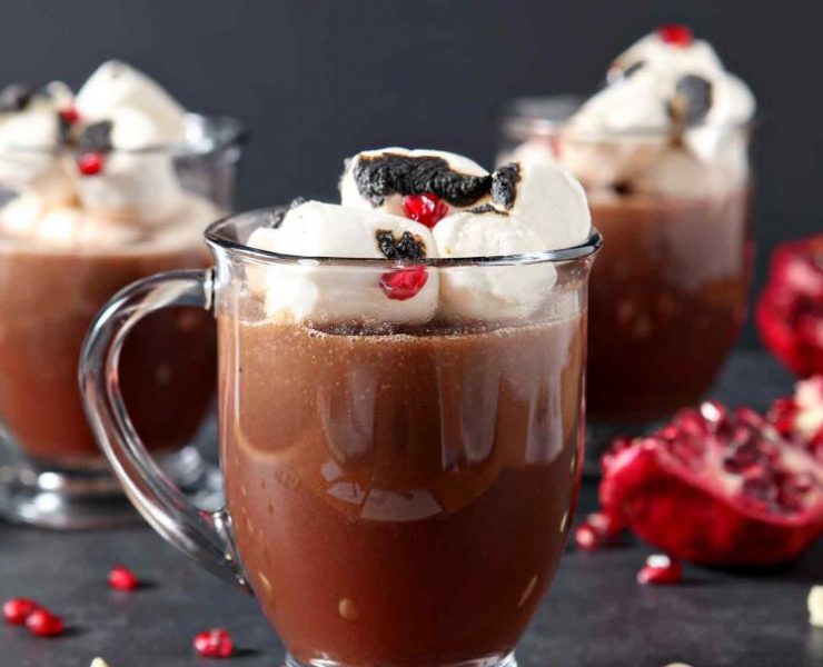 Oversized marshmallows and pieces of pomegranate fill up this cup of hot chocolate.
