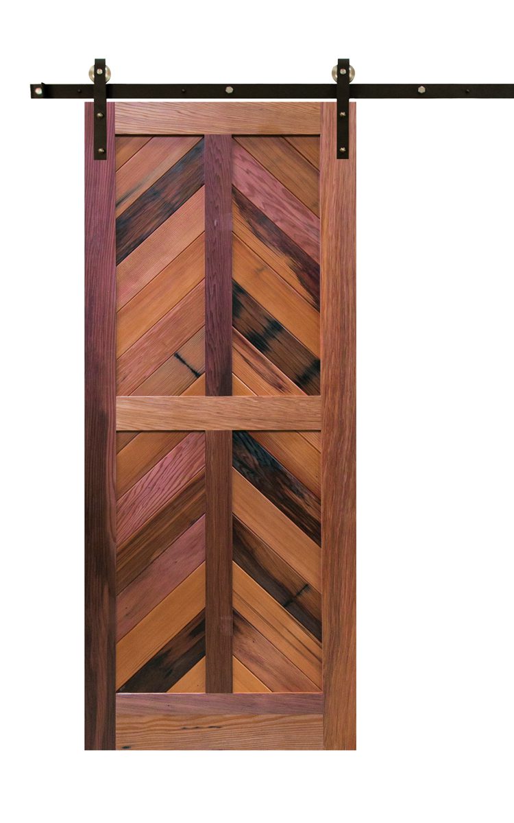 A sliding barn door in several varying shades of repurposed wood