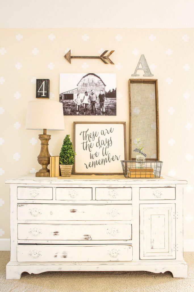 Chippy milk paint dresser with dresser decor and sign art