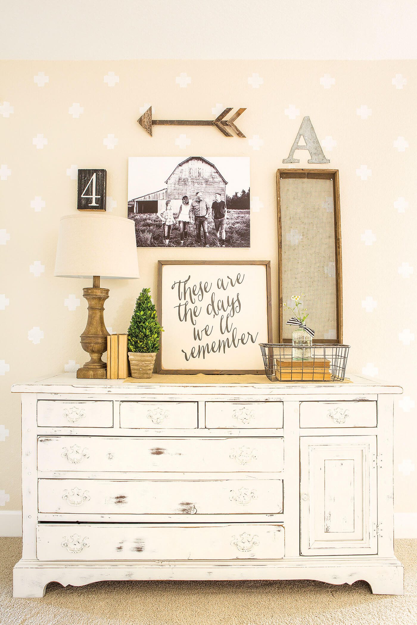 Chippy milk paint dresser with dresser decor and sign art