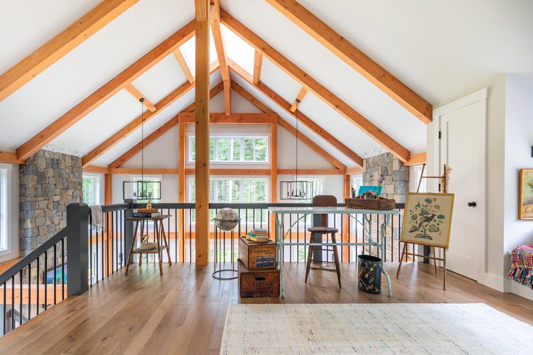 The high ceiling of the Project House has blone wood beams