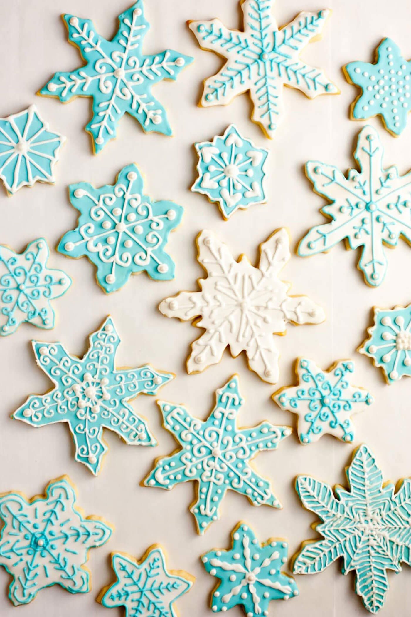 Iced sugar cookies in delicate baby blue and white frosting swirls