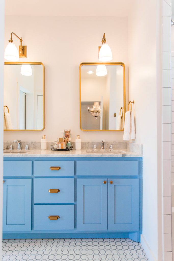 Farmhouse style bathroom with blue vanity