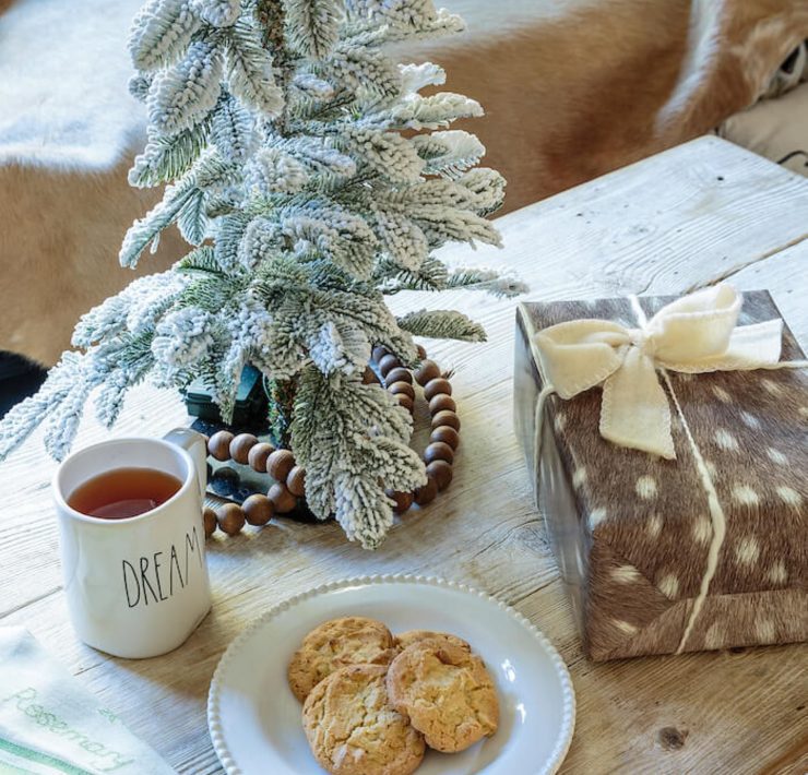 Woodland Christmas theme coffee table with cookies and a small Christmas tree.