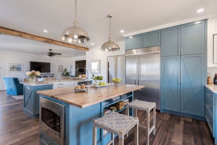 Farmhouse-style paneling in the kitchen island and in the large cabinets