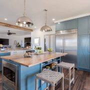 Farmhouse-style paneling in the kitchen island and in the large cabinets
