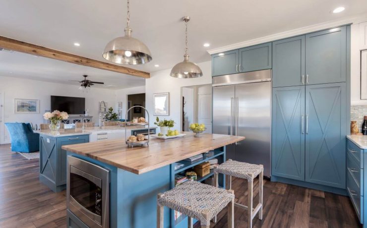 Farmhouse-style paneling in the kitchen island and in the large cabinets