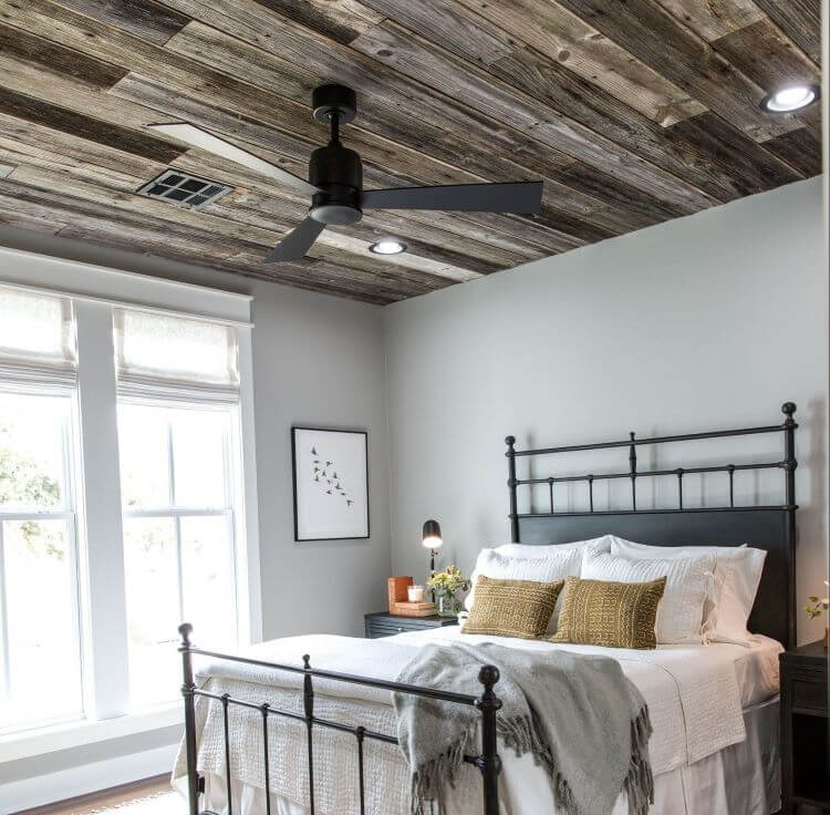 Raw wood adorns the ceiling of the master bedroom.
