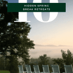 A view of rollign green hilsl from a veranda with a row of white farmhouse style lawn chairs