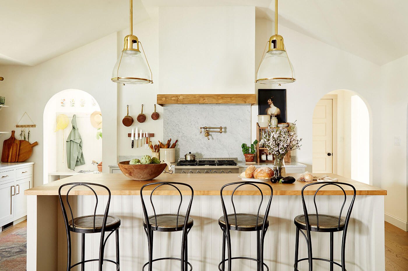 European farmhouse style kitchen with butcher block island