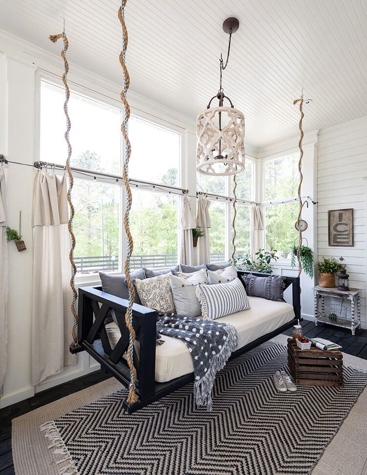 Indoor Georgia porch with shiplap and swinging bed bench