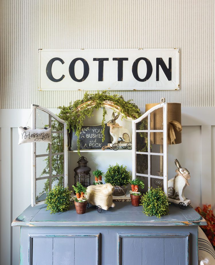 Spring decorations on top of dresser with Cotton sign