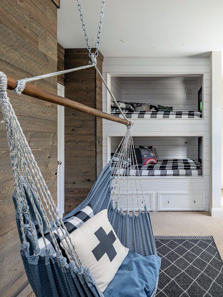 Boy's bedroom with bunk beds and hanging swing