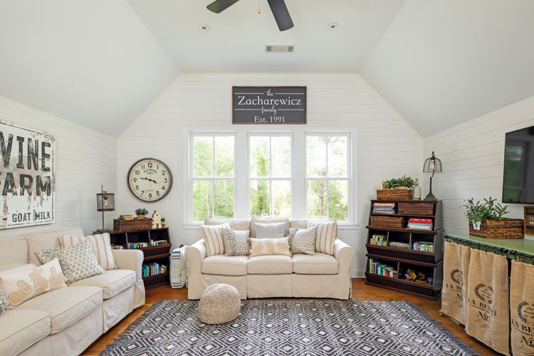 Upstairs living room in Georgia farmhouse with Vine Farm sign