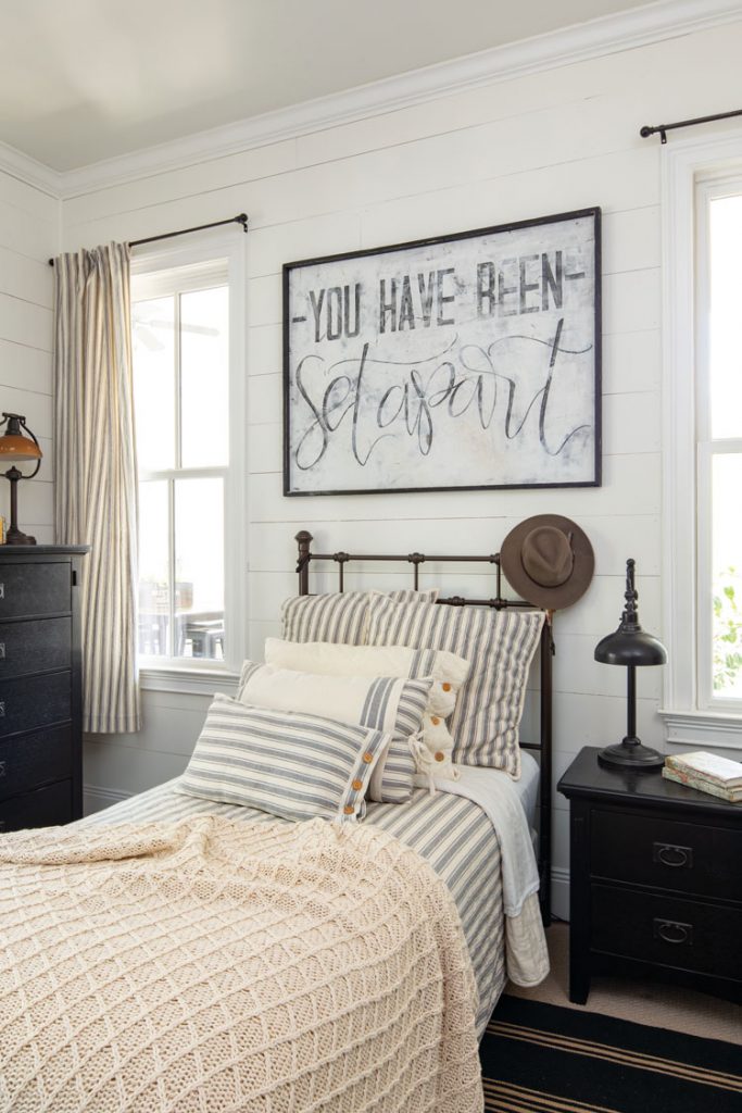 Teenage boys bedroom with ticking stripe bedding