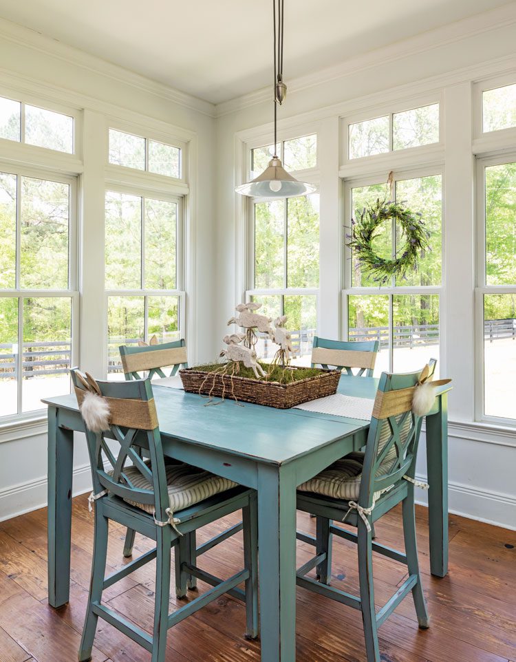 Dining nook with blue table and spring rabbit decorations