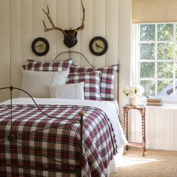 Bedroom with metal bed and red plaid bedding from Gabby's Farmhouse