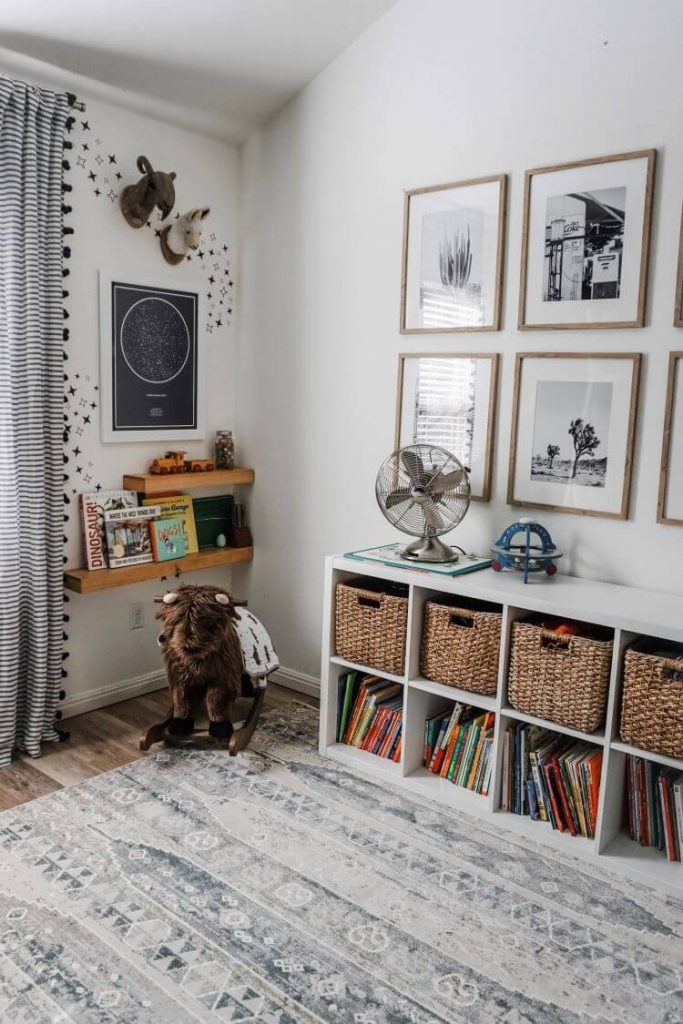 Stuffed toy busts adorn the wall above the buffelo rocker and constellation pictures from etsy