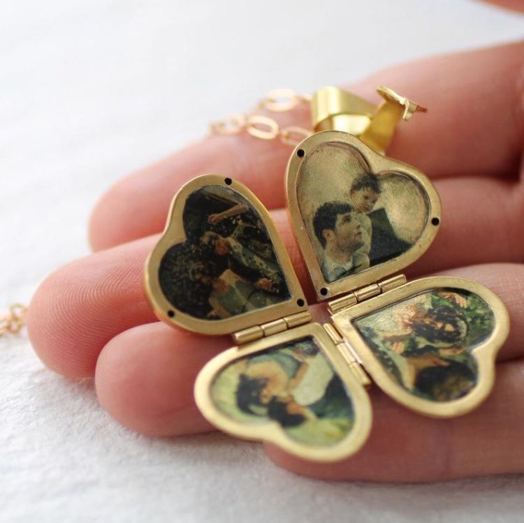 A heart-shaped locket that opens to reveal four pictures of family members