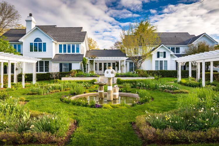 The white exteriors to the accomadations look like large cottages witha fountain and garden in the middle