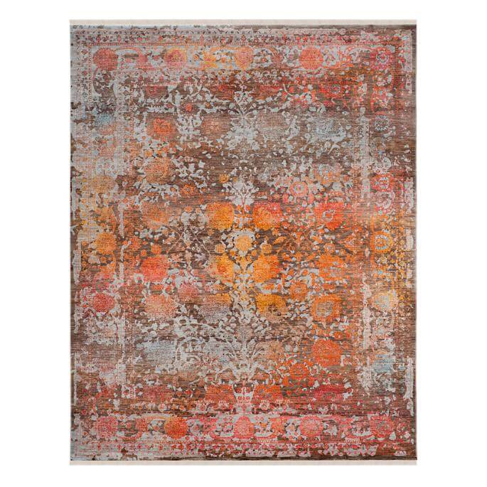 Pink, orange and brown area rug with faded floral patterns for boho style