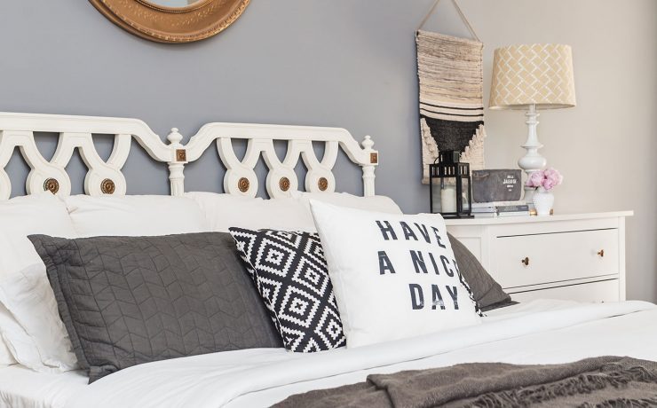 Gray bedroom with white bed