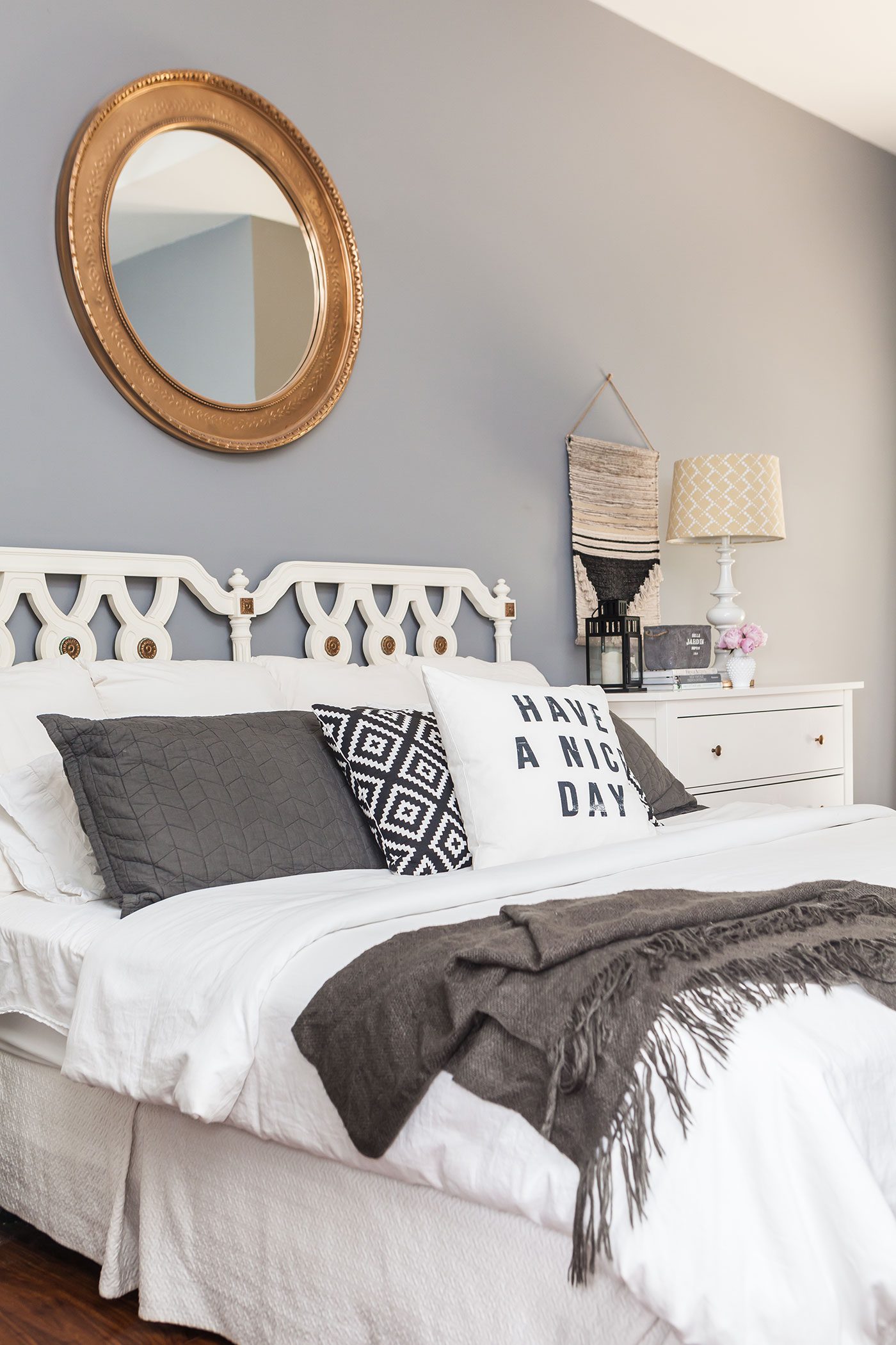 Gray bedroom with white bed