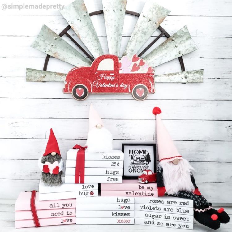 a bundle of collectibles using love gnomes and red trucks in front of a windmill propeller