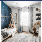 boy's adventure bedroom with navy blue and text