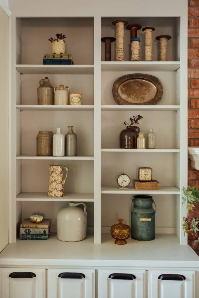 vintage accessories on bookshelves