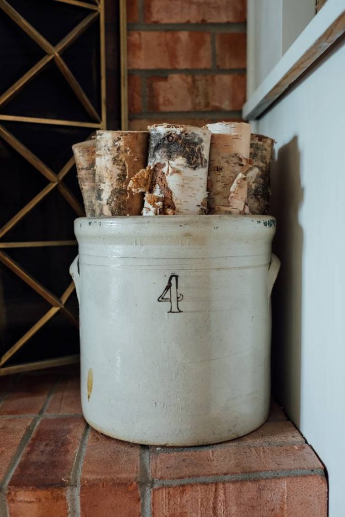 antique crock with firewood