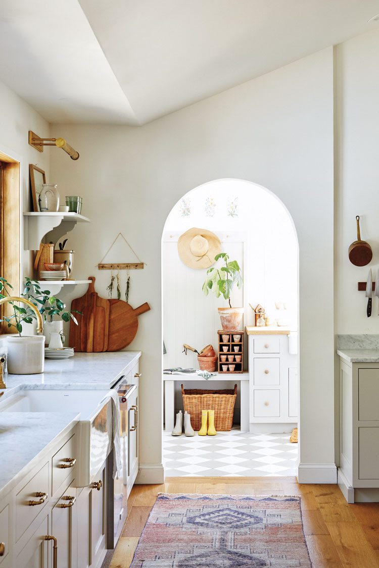 The home's mudroom incorporates grey and white checkered floor