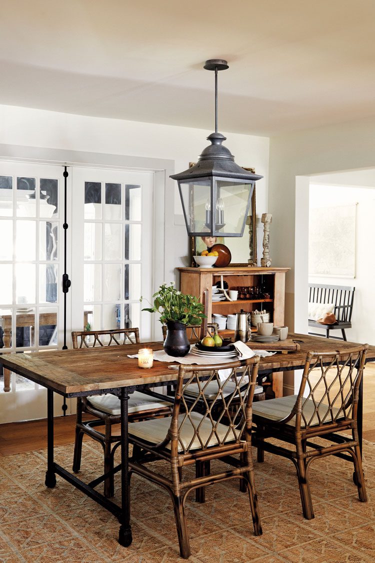 The room has neutral colors and the furniture sports unlacquered brass finishes