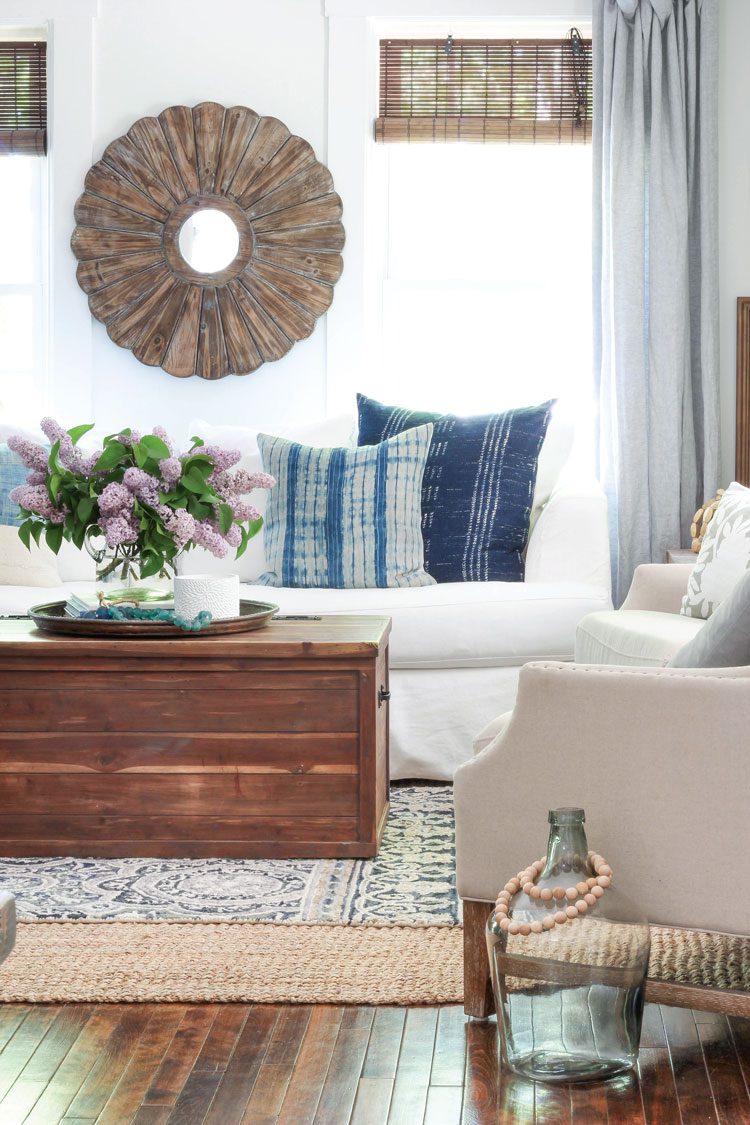 Living room with blue and white color palette and blue pillows