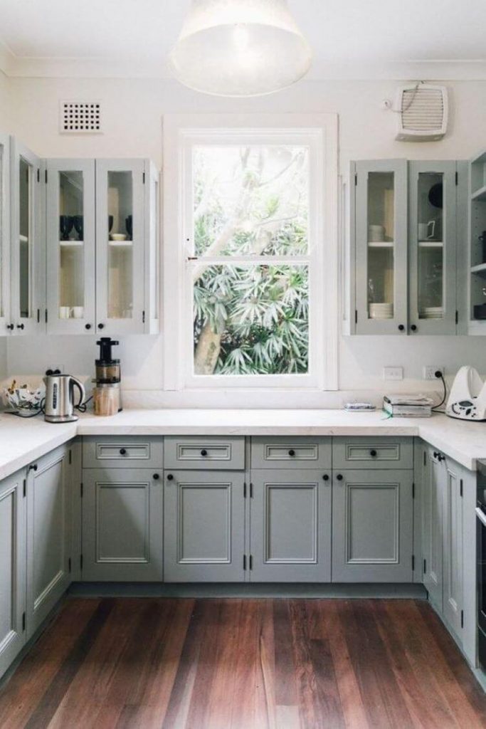 blue-gray kitchen with medium dark floors