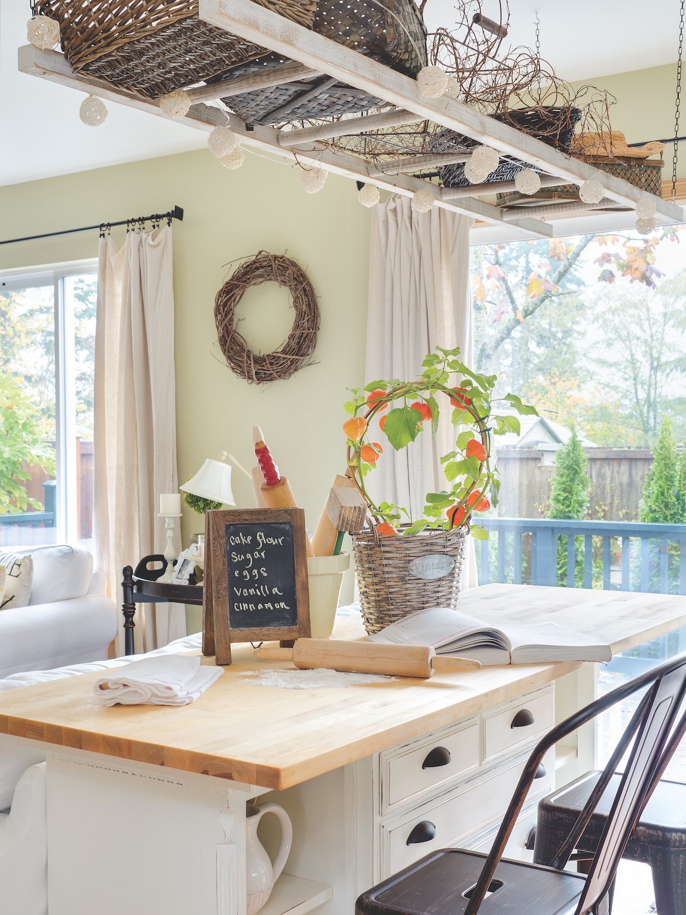 Butcherblock island in kitchen with recipe book and rolling pin