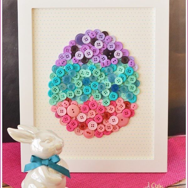 Homemade wall art with buttons in easter egg shape