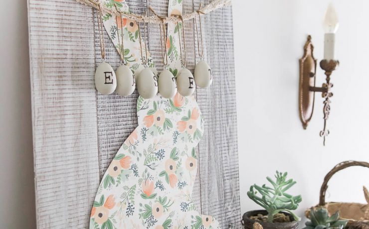 Easter mantel with bunny sign and hanging eggs