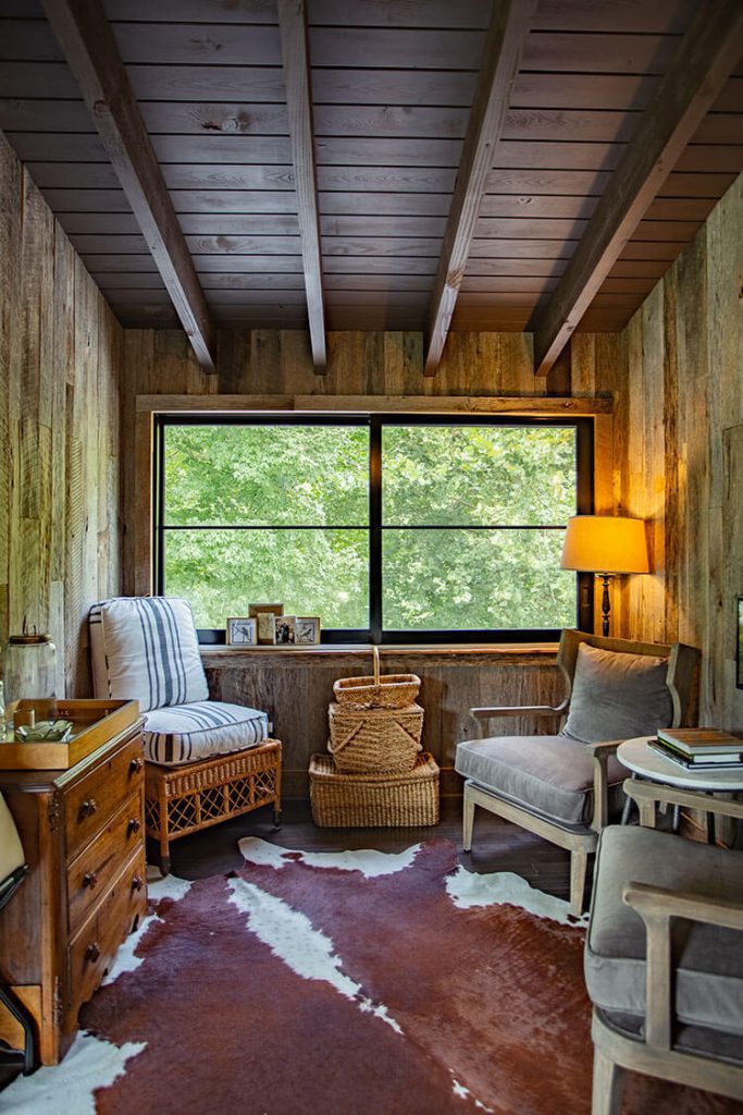 Small room with exposed ceiling beams and seating