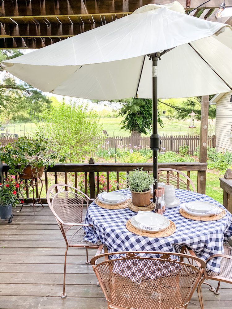 Outdoor table with blue checked tablecloth