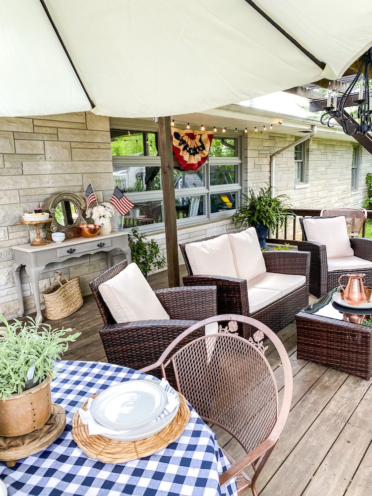 Backyard with table and side table for hosting 4th of July