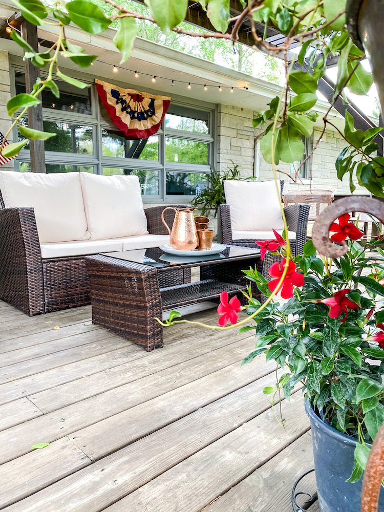 Seating area and flowers outdoors for hosting 4th of July