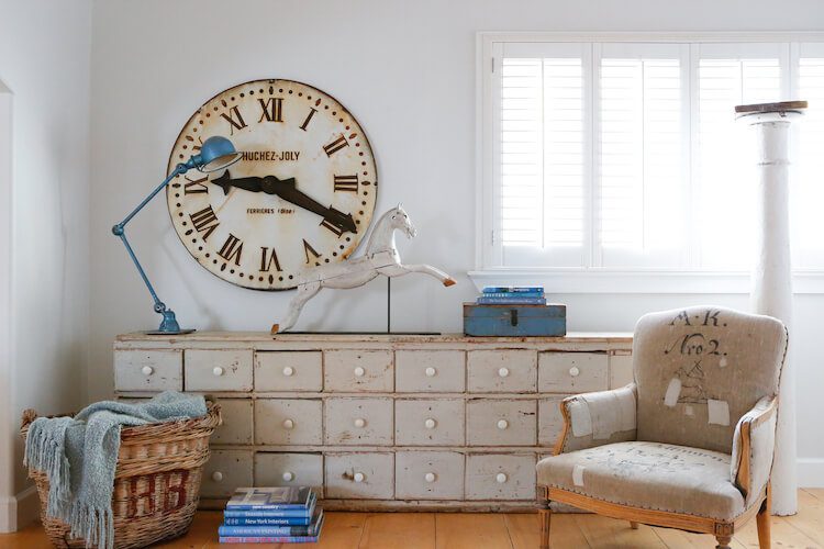 Vintage cubby cabinet and deconstructed chair with other vintage items for flea market shopping tips