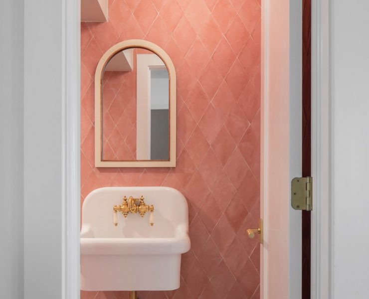 Powder room with pink bathroom tile